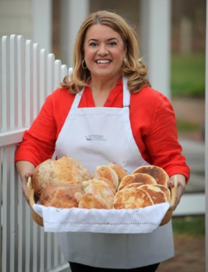 Maria Lawton showing a basket full of breads