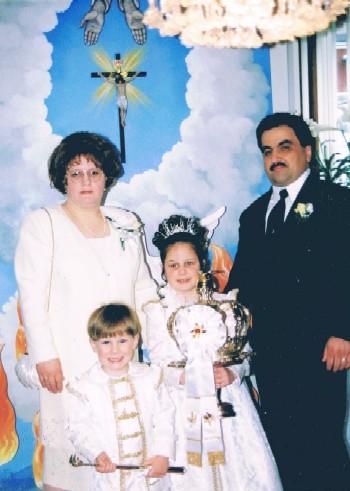 The Faria Family; Kayla in the center holding the Holy Ghost crown.
